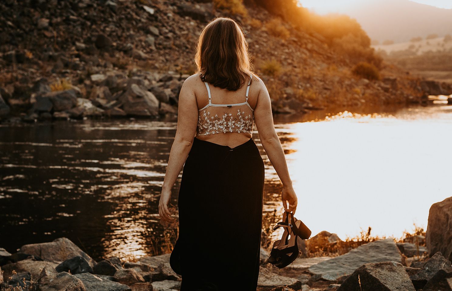 Young woman enjoying the golden hour sunset.