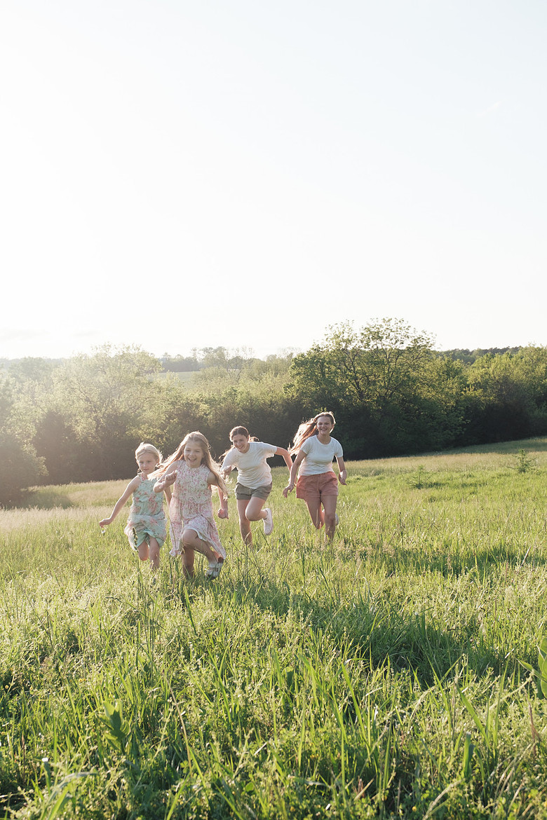 family photo outdoor mother's day shoot sedalia missouri playful daughters sisters