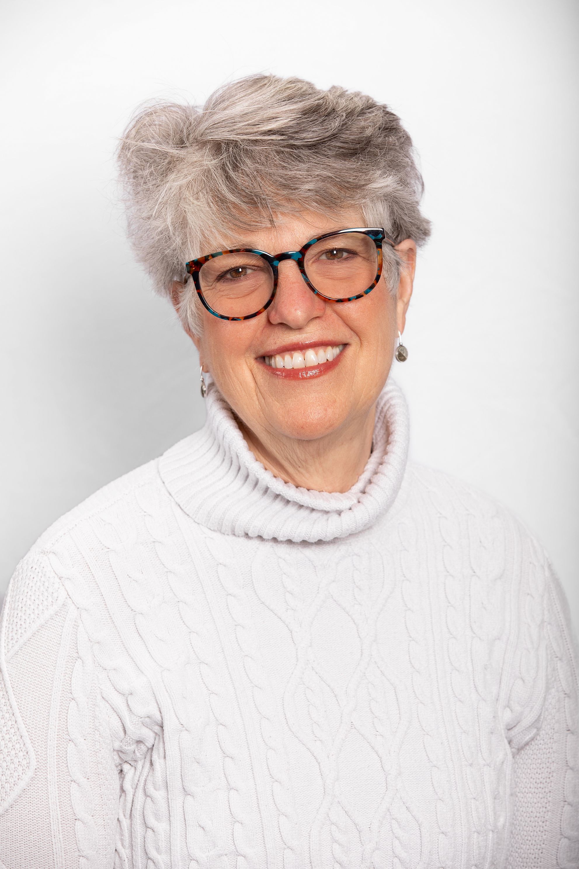 Beautifully captured headshot of a woman who needed an updated image for her retirement party.