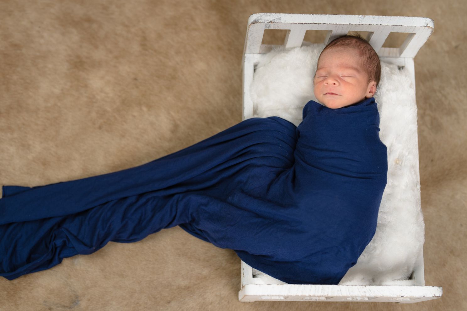 Newborn in Blue Wrap