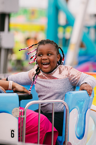 Abigail S, age 7, from Lexington, SC, on the teacup ride at the South Carolina State Fair on October 9th, 2024. Abigail and her mom spent the day riding rides at the fair, having a mother-daughter day! “This is my favorite ride, my mom spins it so fast,” said Abigail. The fair has a variety of rides for kids, including the Flying Jumbos, a kiddie ride that spins children in the air, and the Money Maze, a kid-friendly maze with a monkey theme. Photo taken by Zoe Orechwa 2024.
