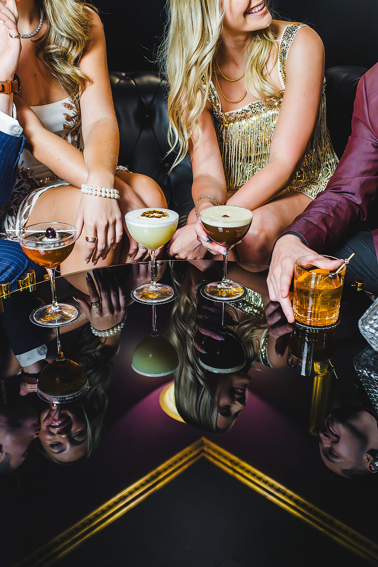 Two women and two men enjoying cocktails at Falcon's Lair in Ripon, CA. Shot by ShootAnyAngle.com