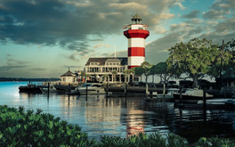 The sunrise glistens the vibrant colors of the Harbour Town Lighthouse in Hilton Head