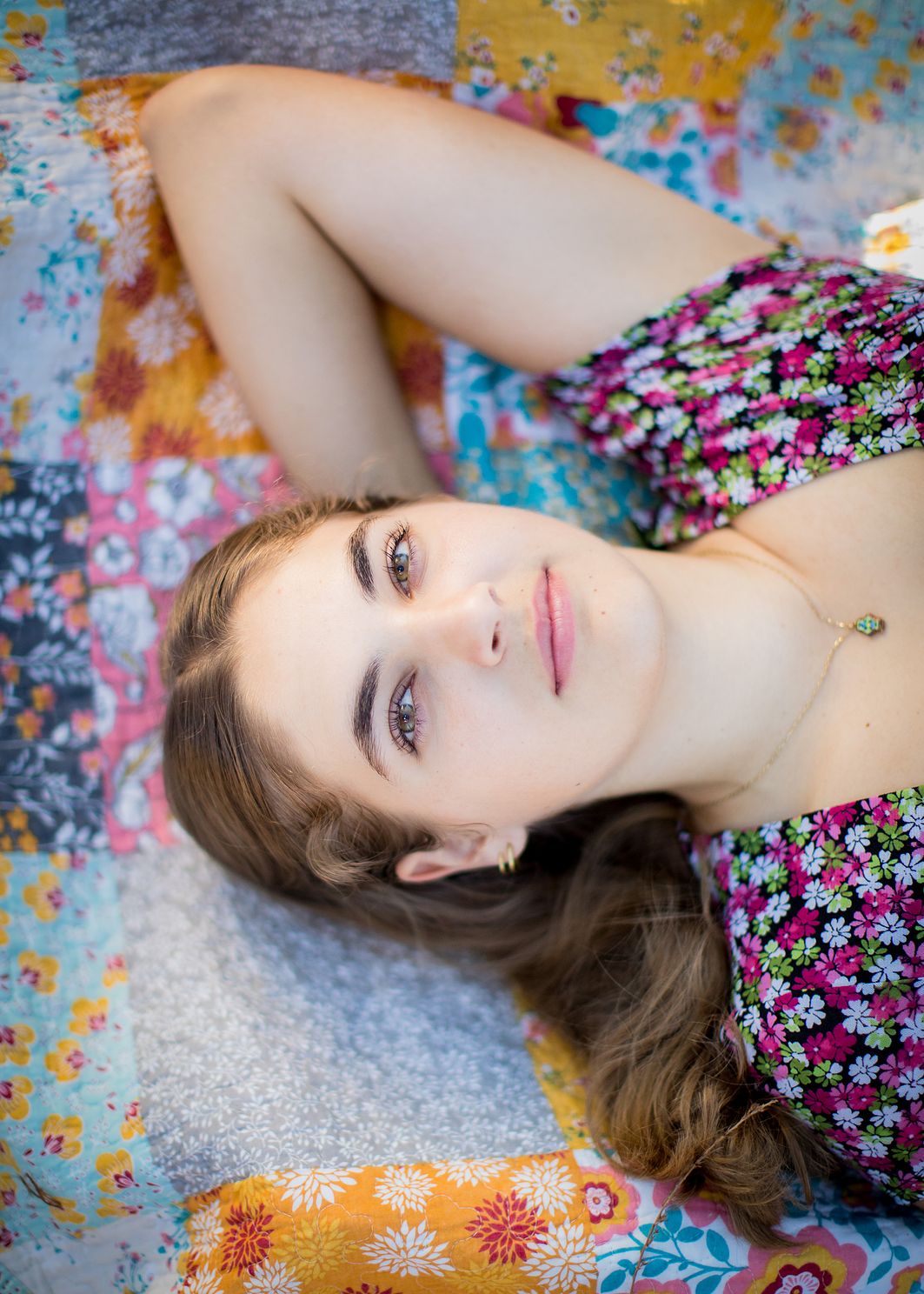 Senior laying on back looking at camera