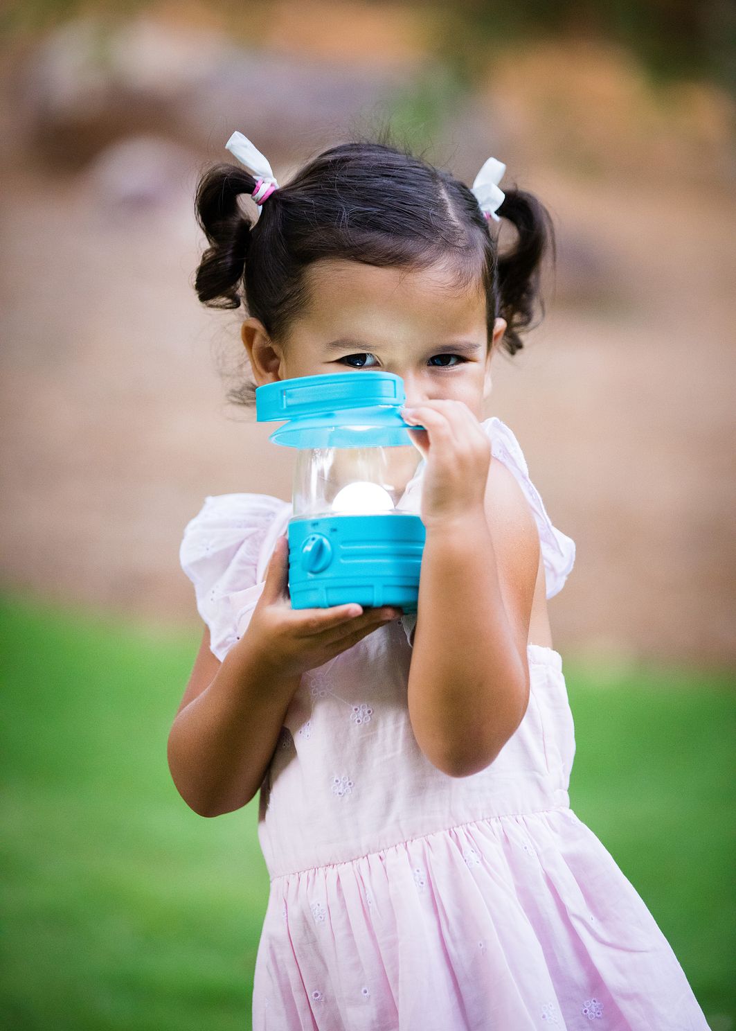 Closeup of Toddler showing lantern outside
