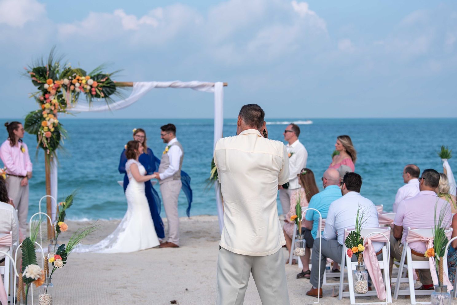 Mike photographs a wedding ceremony on Nokomis beach