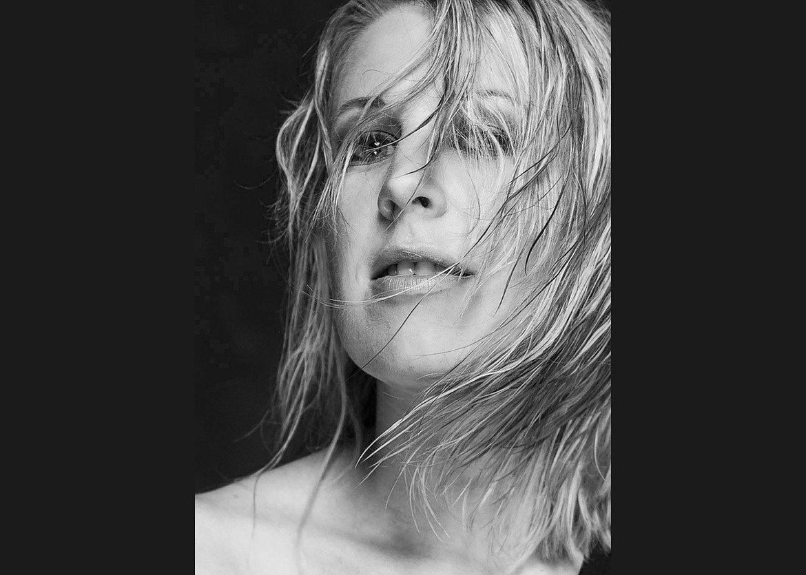 Gritty beauty portrait photography in studio. Using a little water to wet hair and making it gritty
