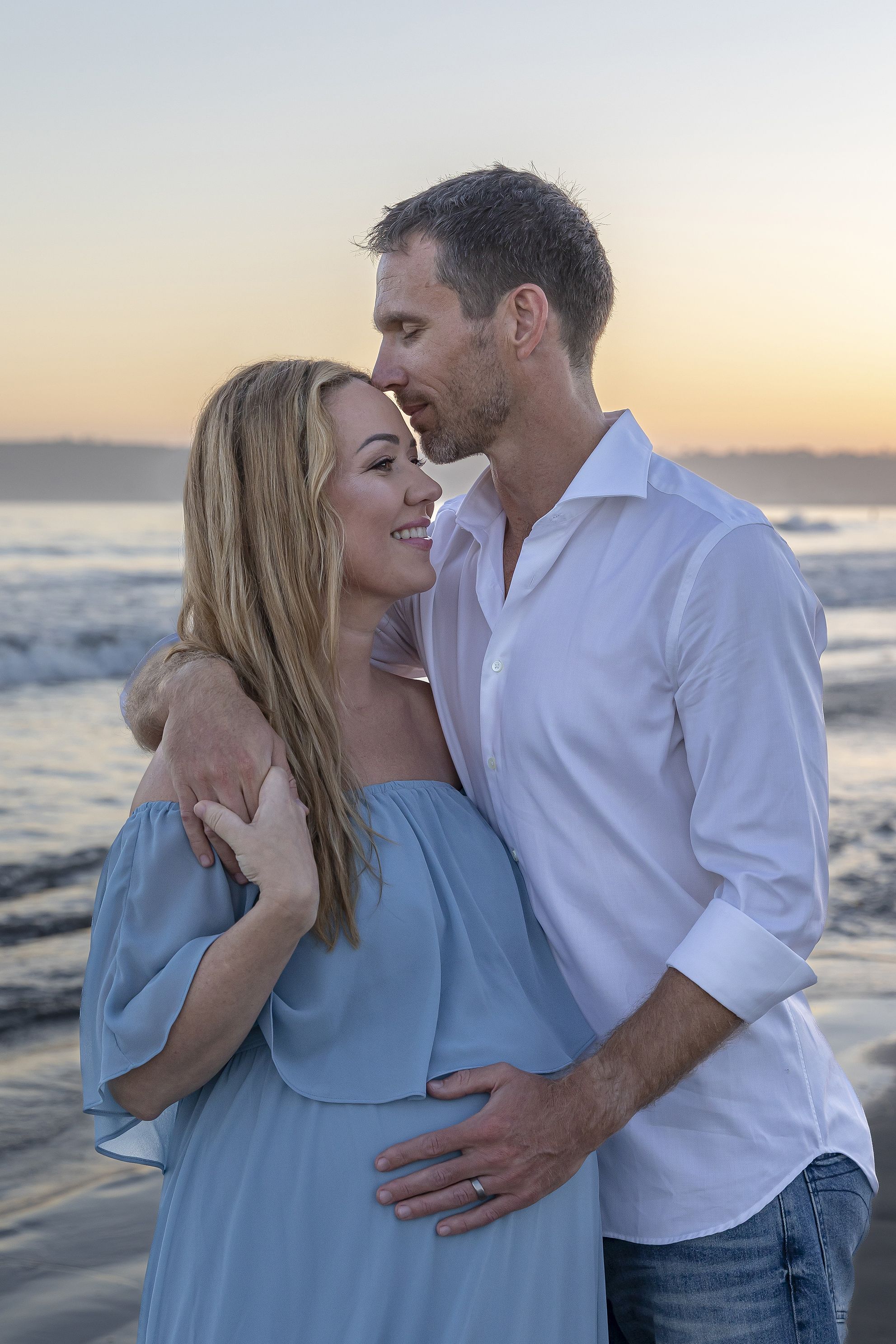Beach Maternity image, husband and wife at sunset, California