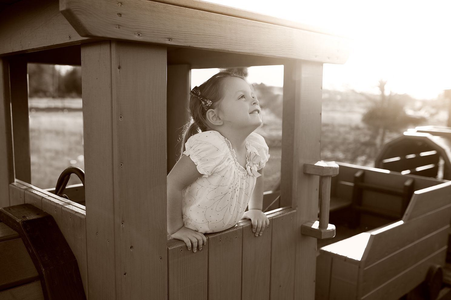 girl smiling looking at sky