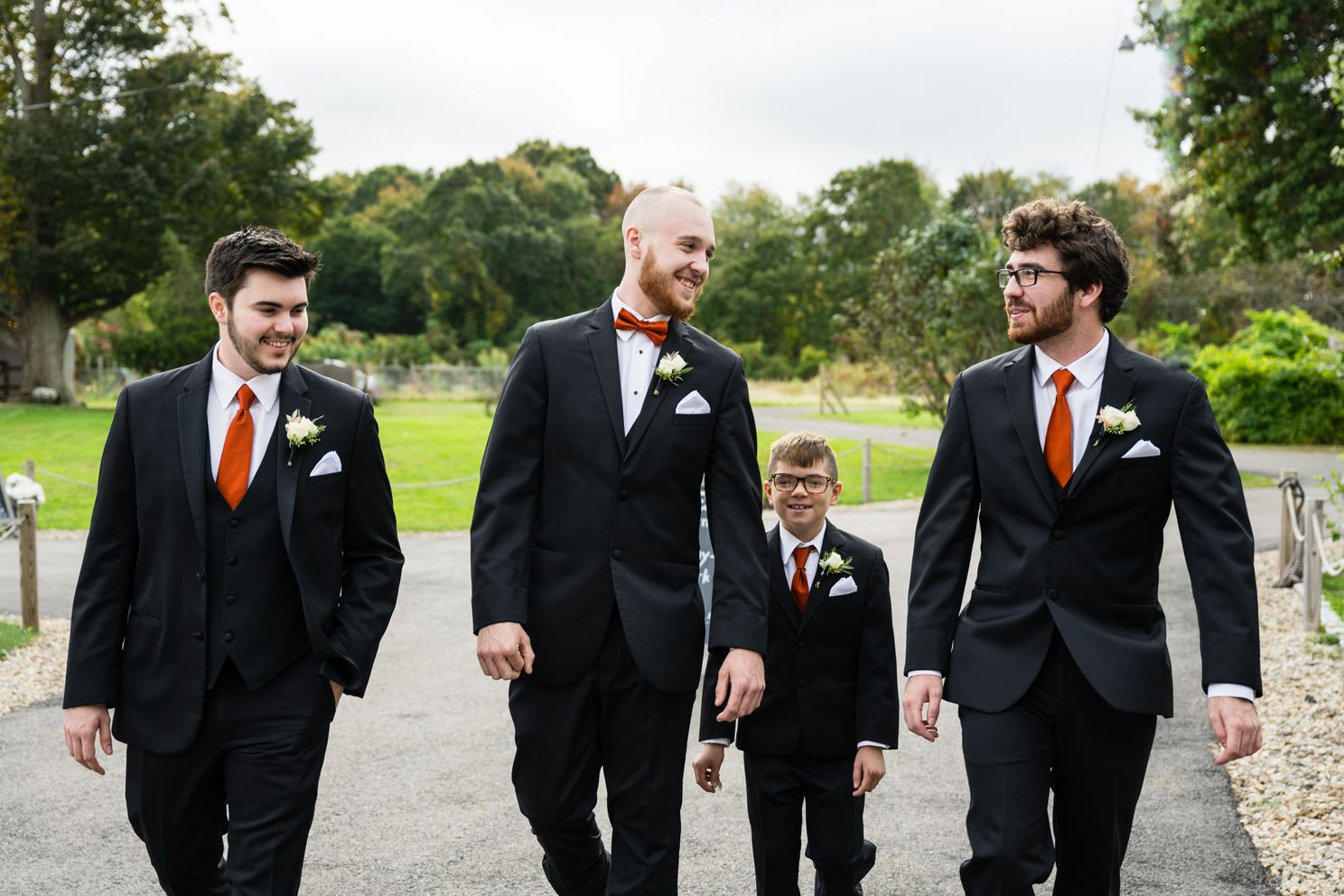 groom and groomsmen walking candidjpg