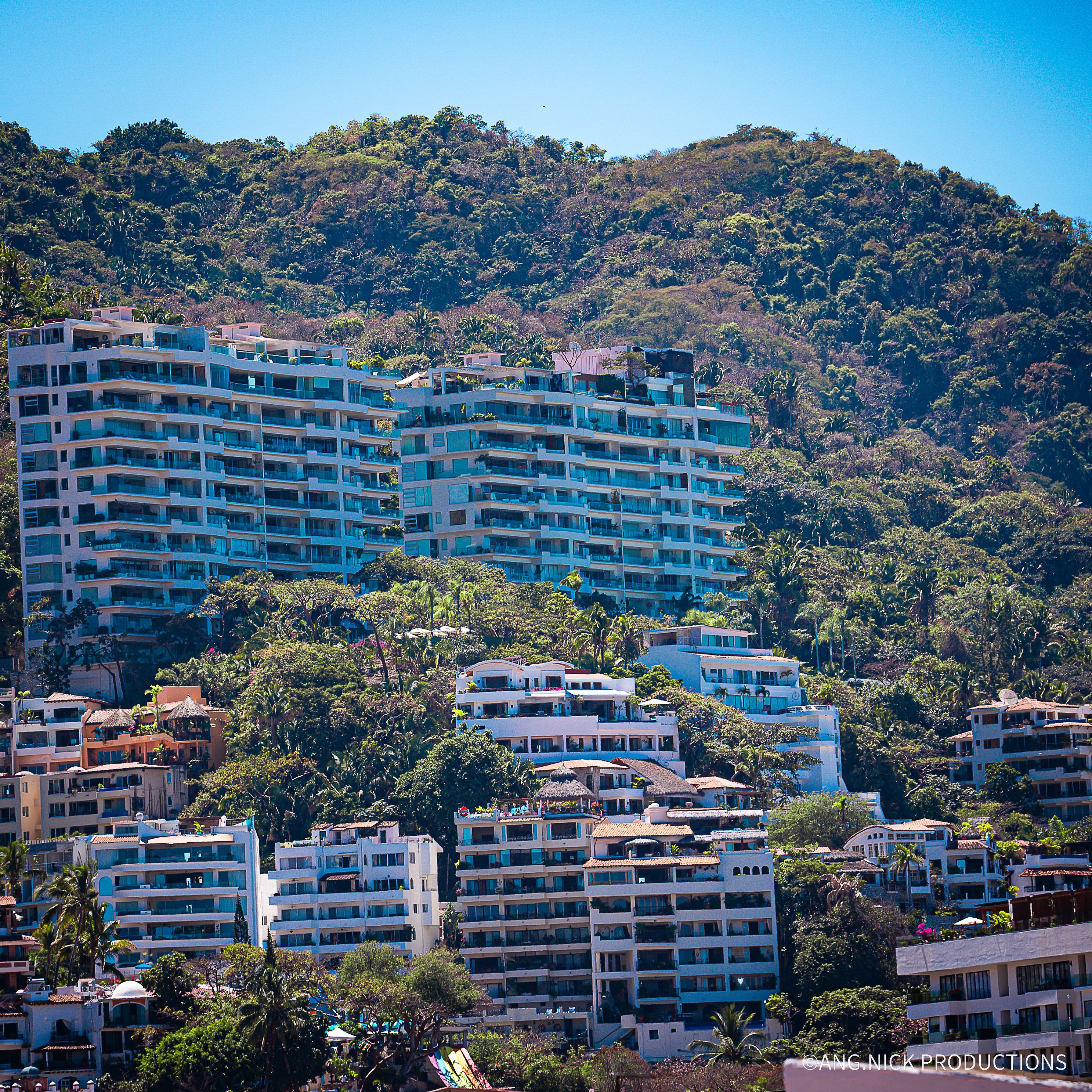 Mountain side and beautifully designed buildings overlooking the coastline in Puerto Vallarta