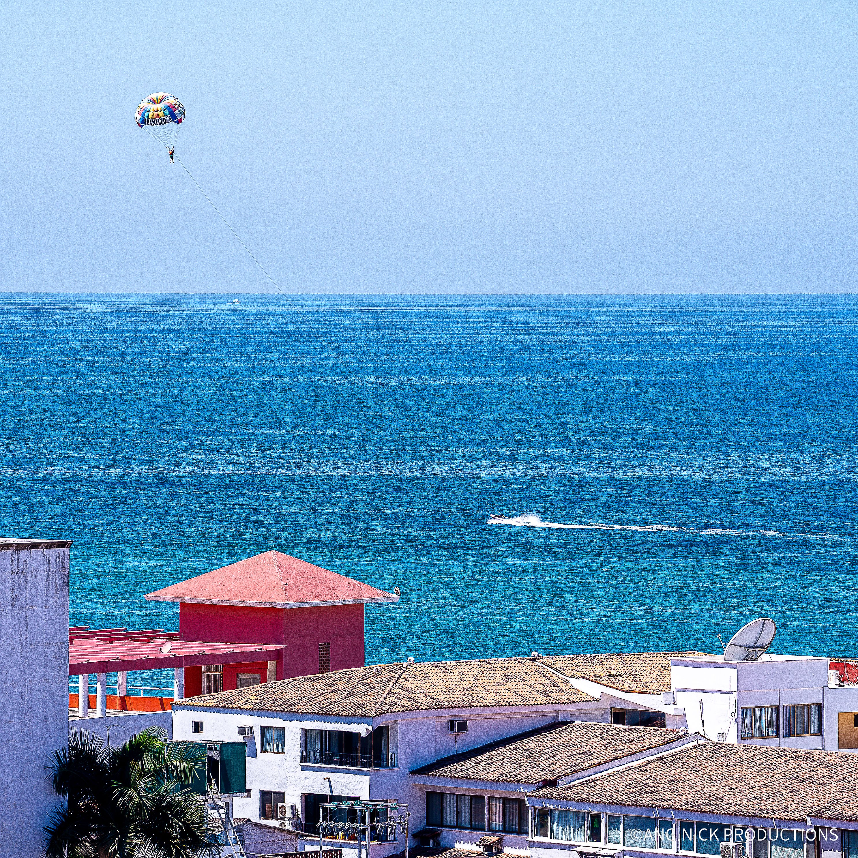 Scenic panorama of vibrant buildings with the ocean in a Mexican city
