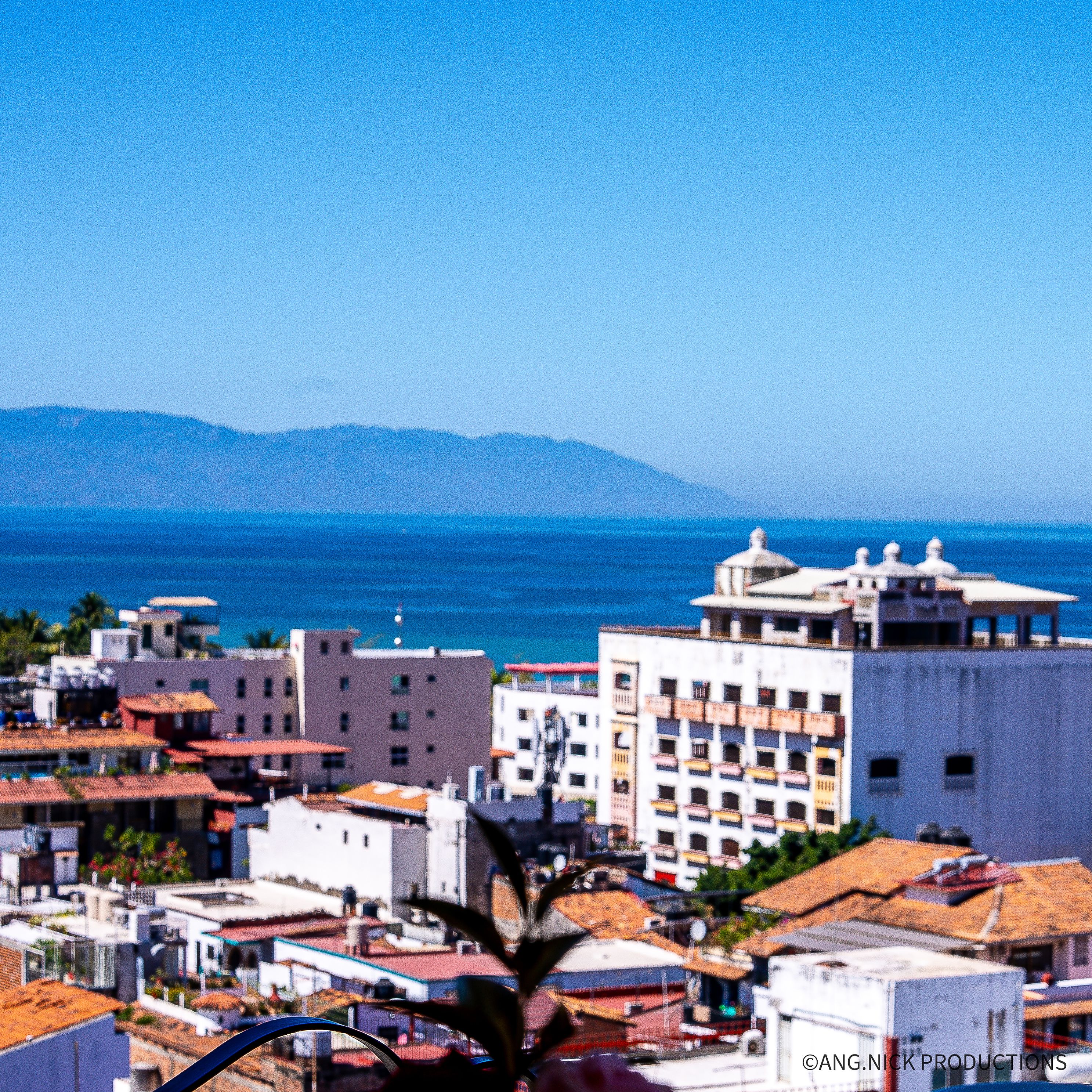 Beautiful view of colorful buildings and the ocean in a coastal city in Mexico