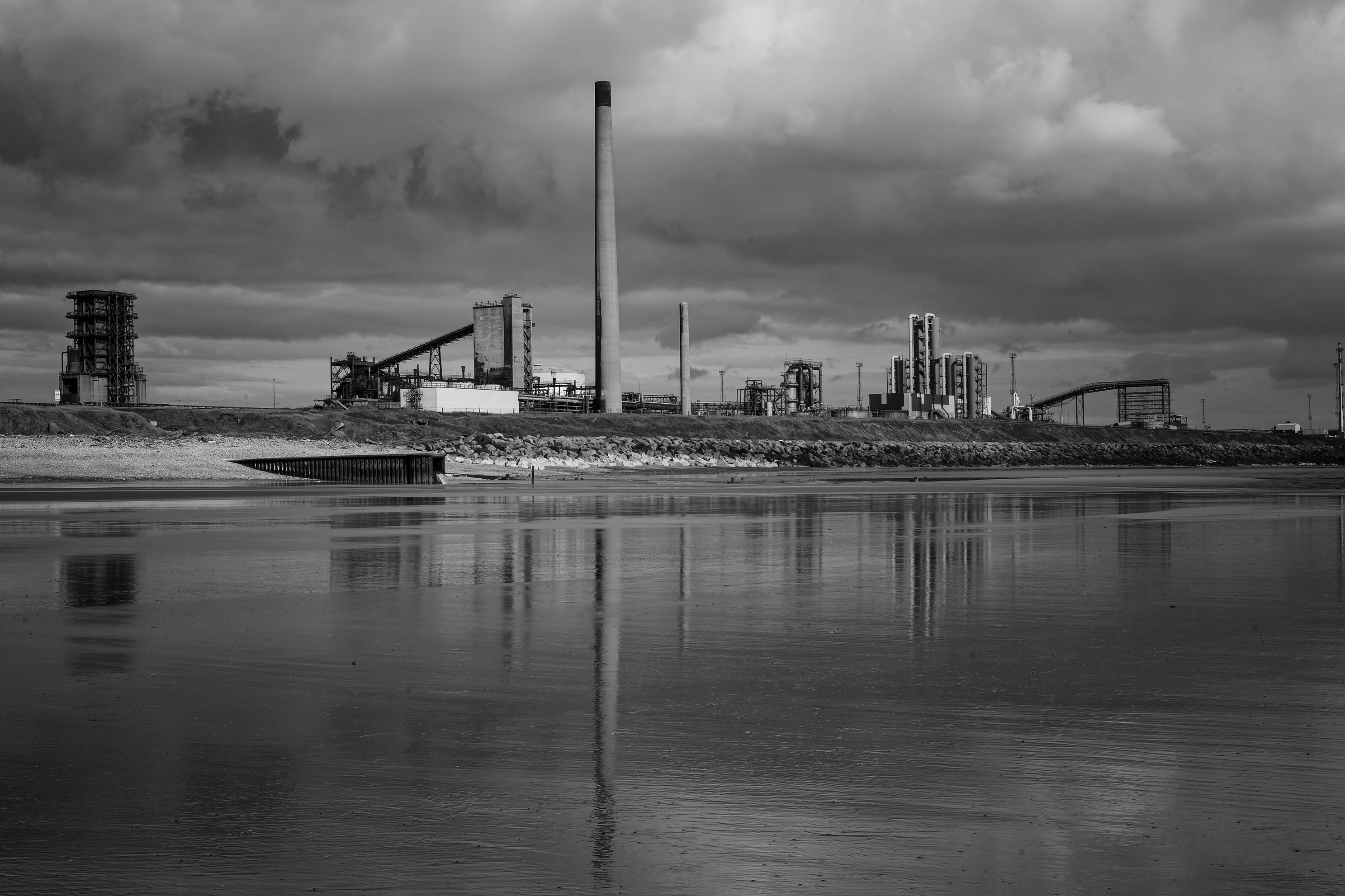 Tata Steelworks looking like an amusement park on the edge of Margam beach, Port Talbot