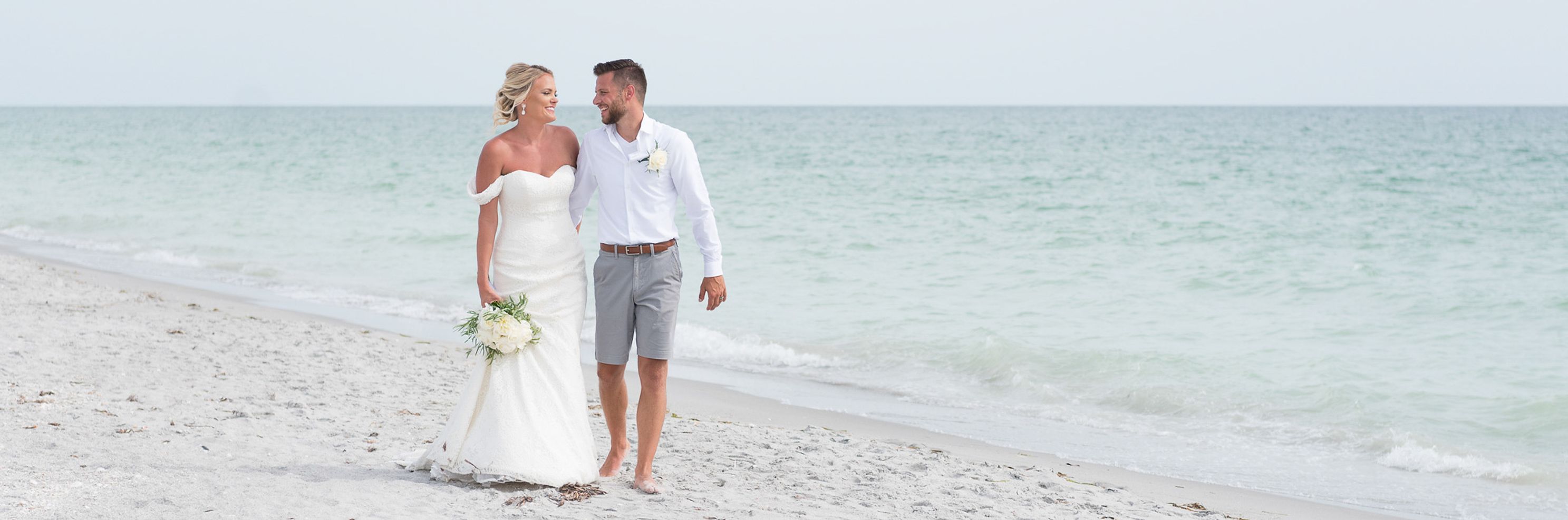 married-couple-walk-along-the-beach-in-florida.jpg