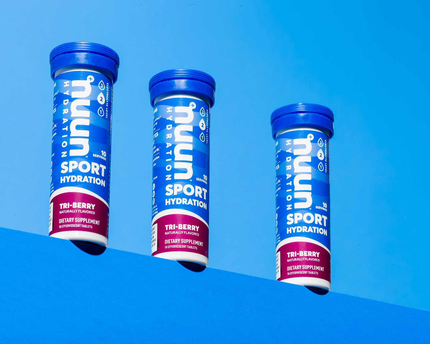 Nuun hydrations tubes captured on blue shelved background 