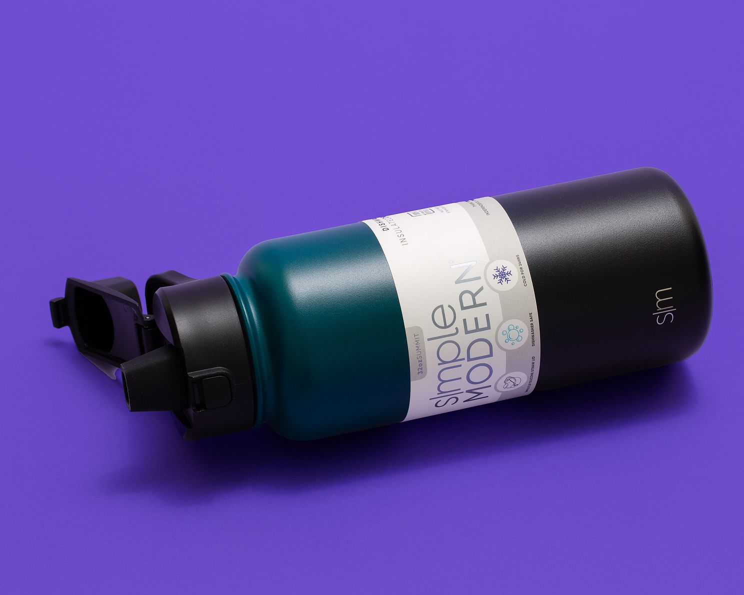 Simple modern water bottle captured on bold purple