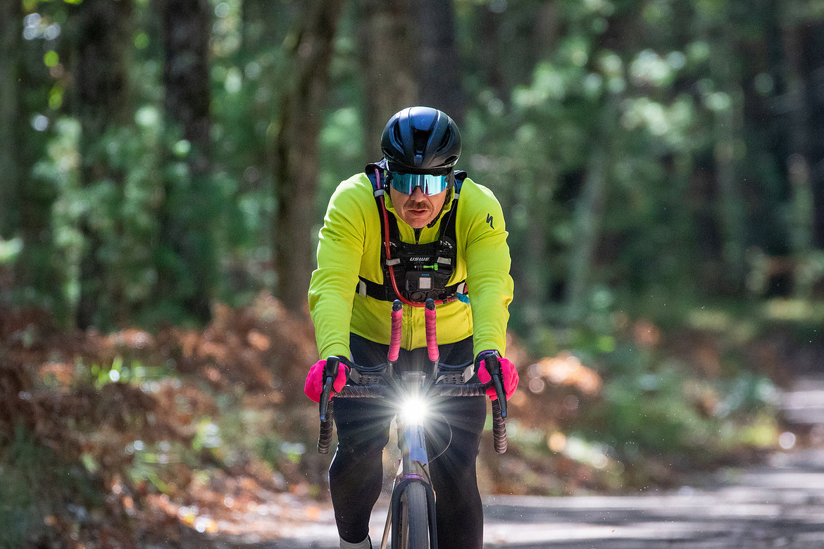 A gravel cyclist races through Manistee county at the 2024 Rusty Fish bike race