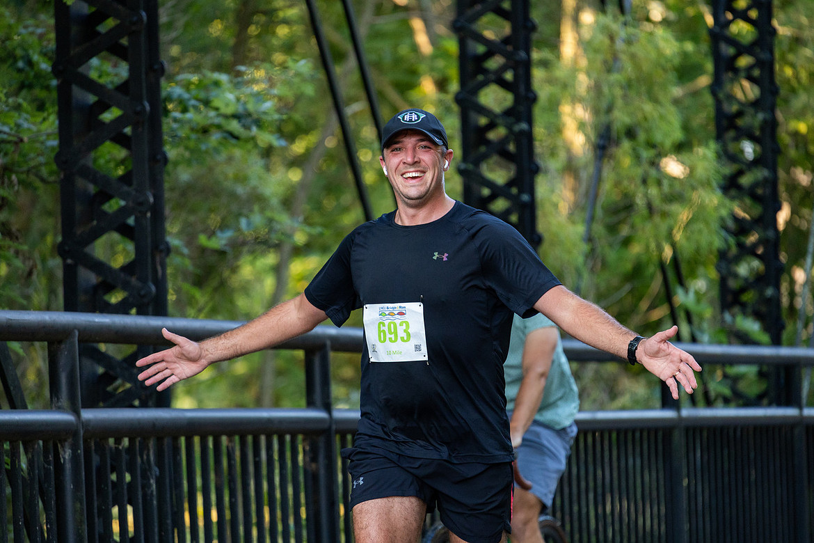 A runner crosses one of many bridges at the LMCU Bridge Run