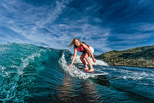 Megan Surfing a Boat Wake - I'm laying on the swim step for fish