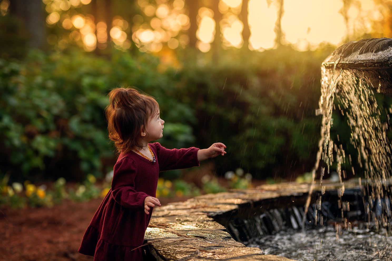 little girl photo near fountain in Raleigh