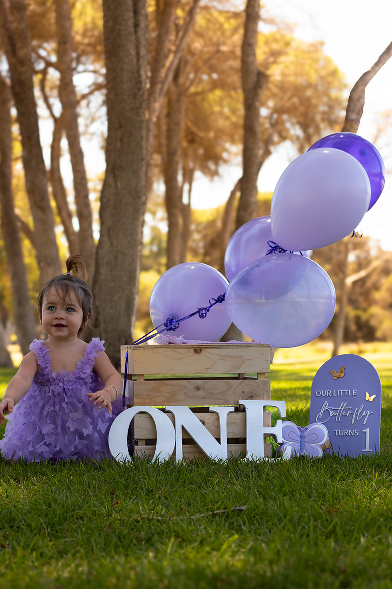 Purple butterfly first birthday photoshoot Perth - Fyrefly Photography outdoor milestone session