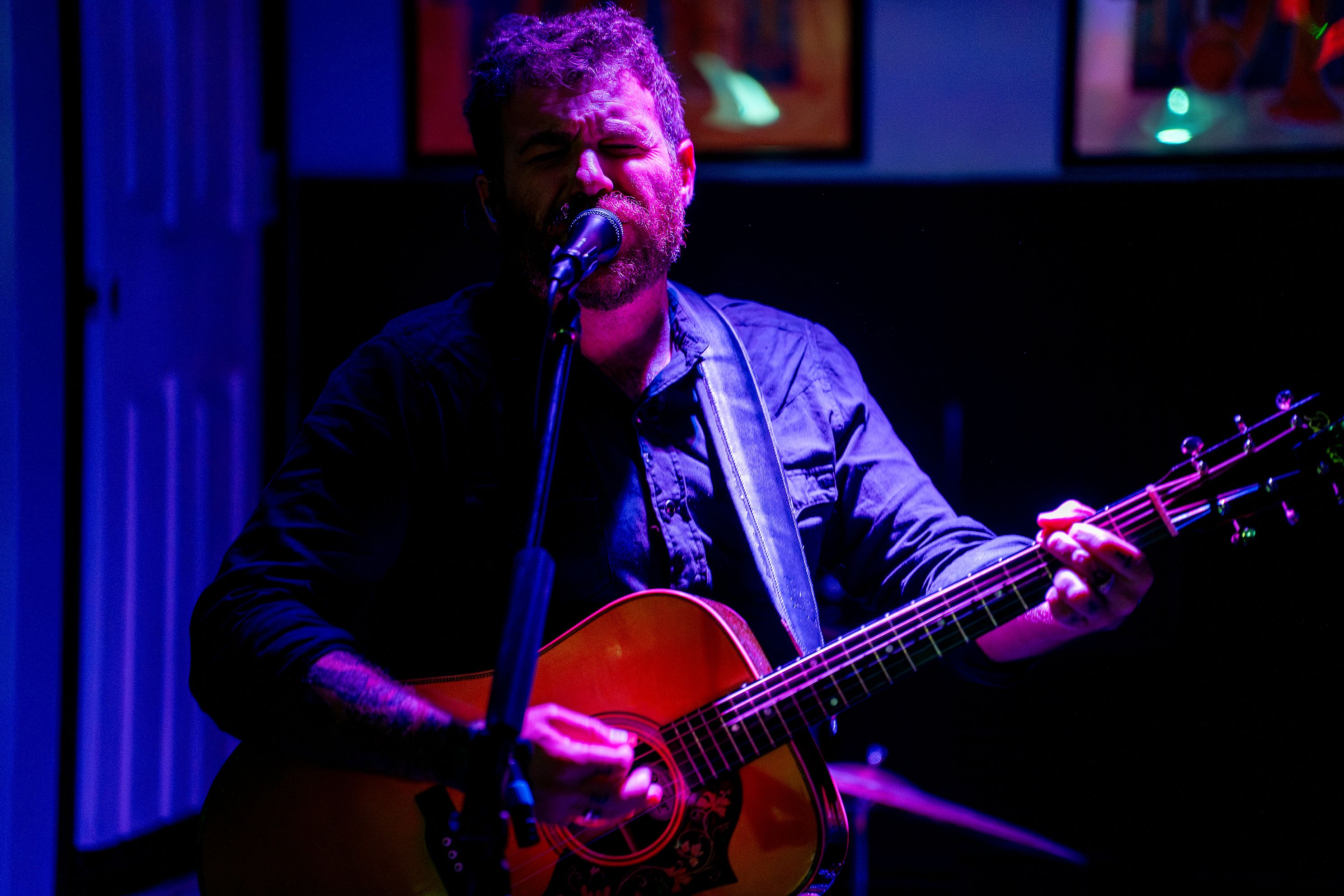 A person plays a guitar.
