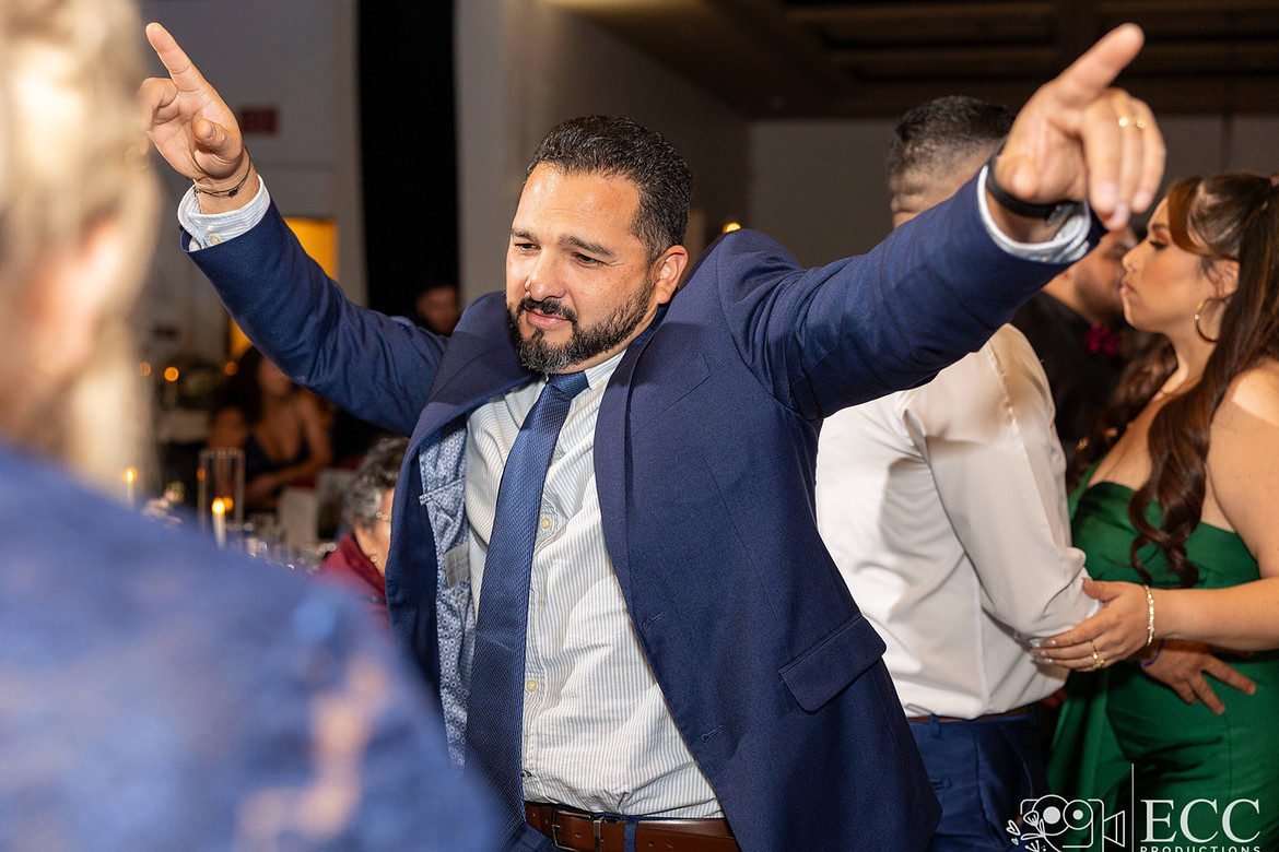 Dancing groomsmen during the wedding reception. Bay area wedding in San Jose.