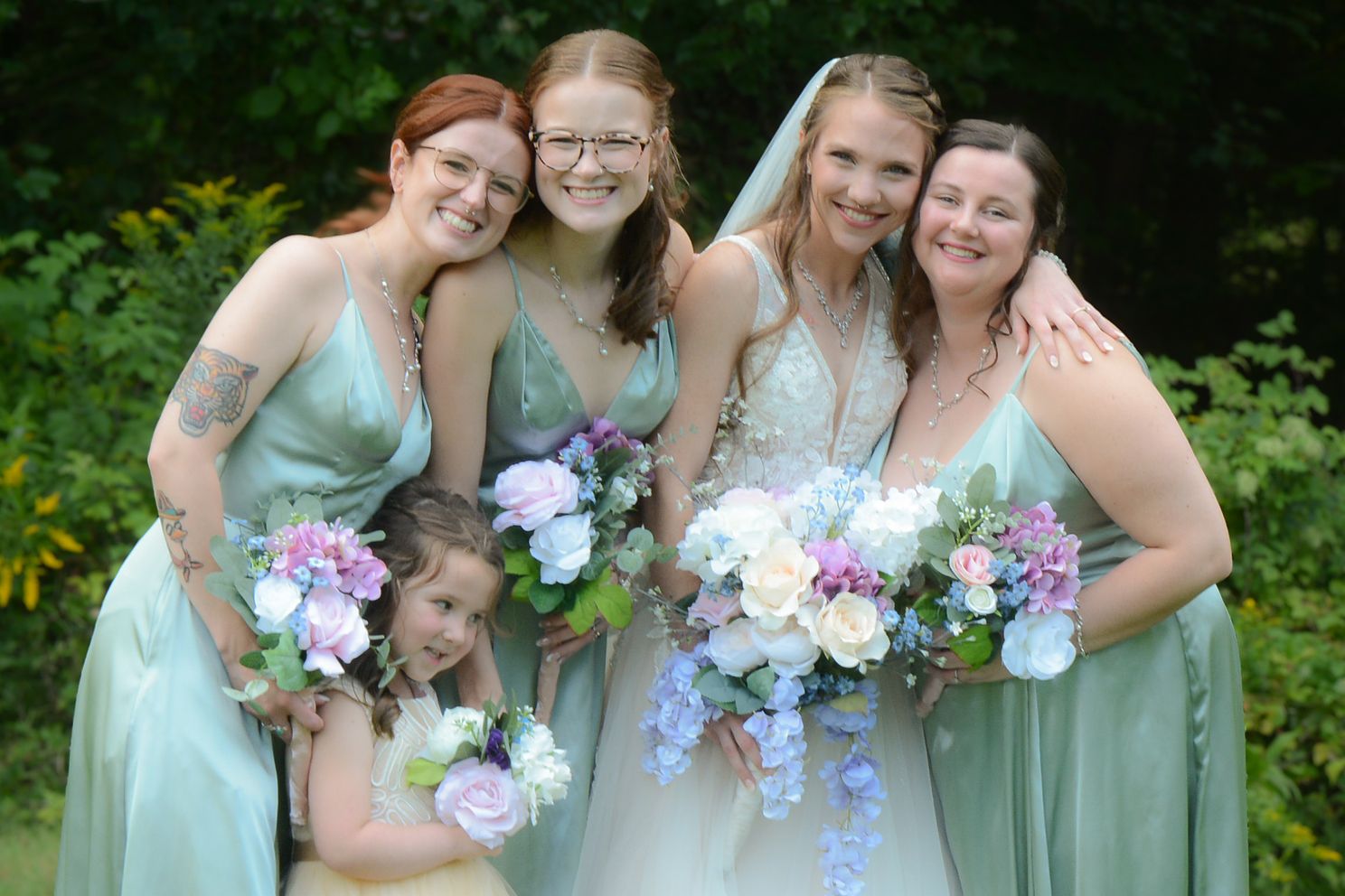 DSCjpg bridesmaids gather for picture with smiling faces and pretty flowers outdoors before ceremony