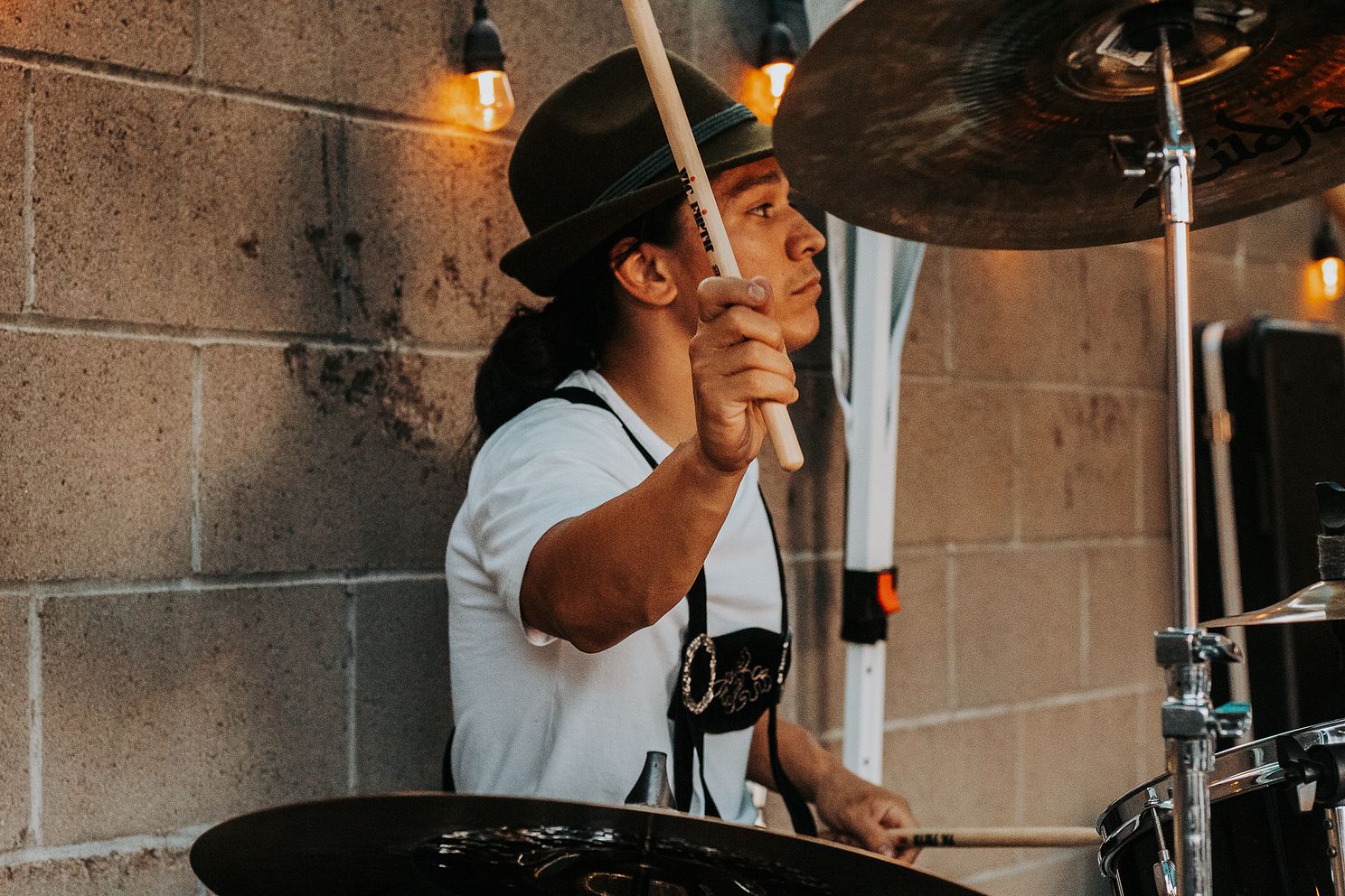 Polka band drummer playing at an Oktoberfest.