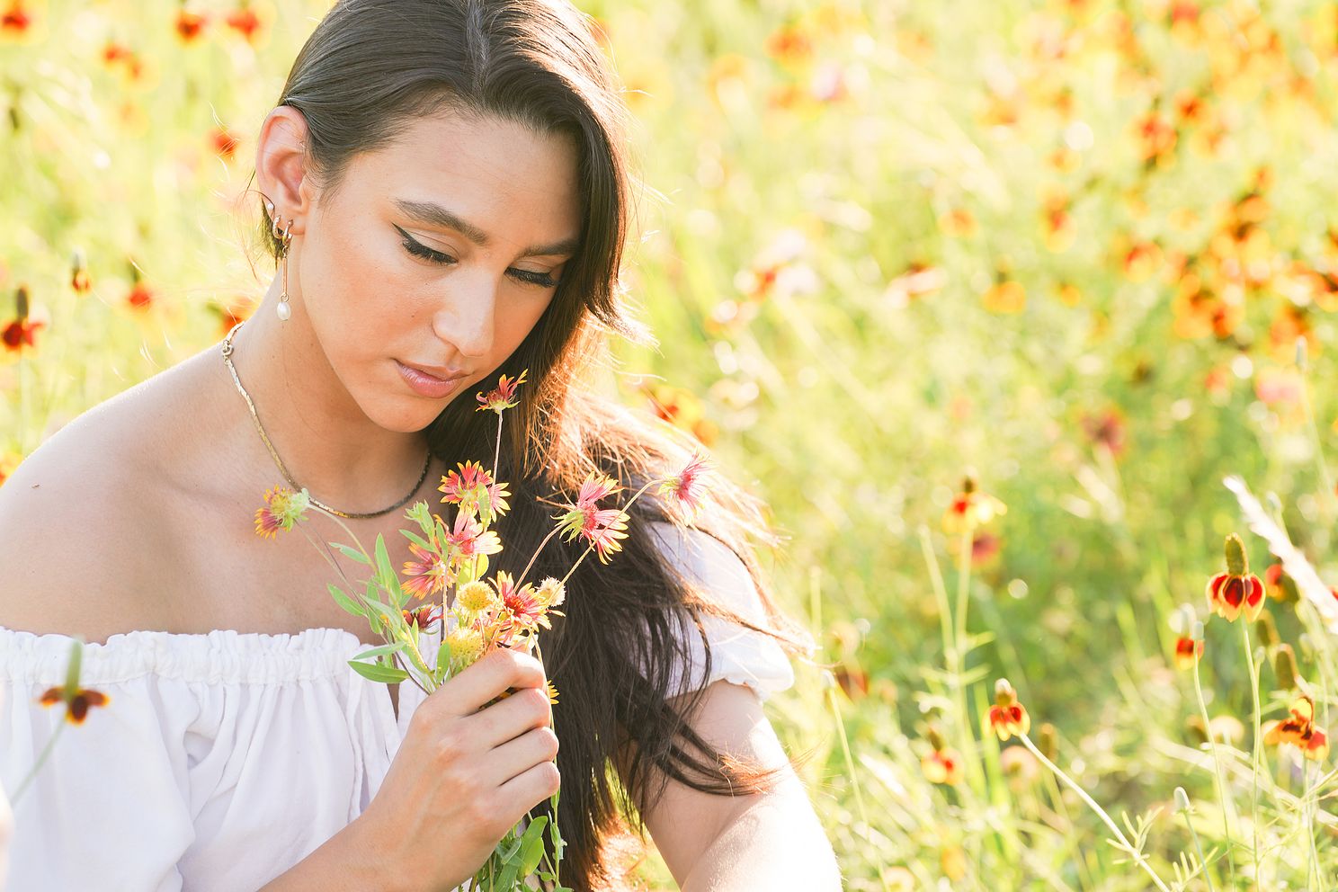 beautiful senior photography of high school student in field of flowers