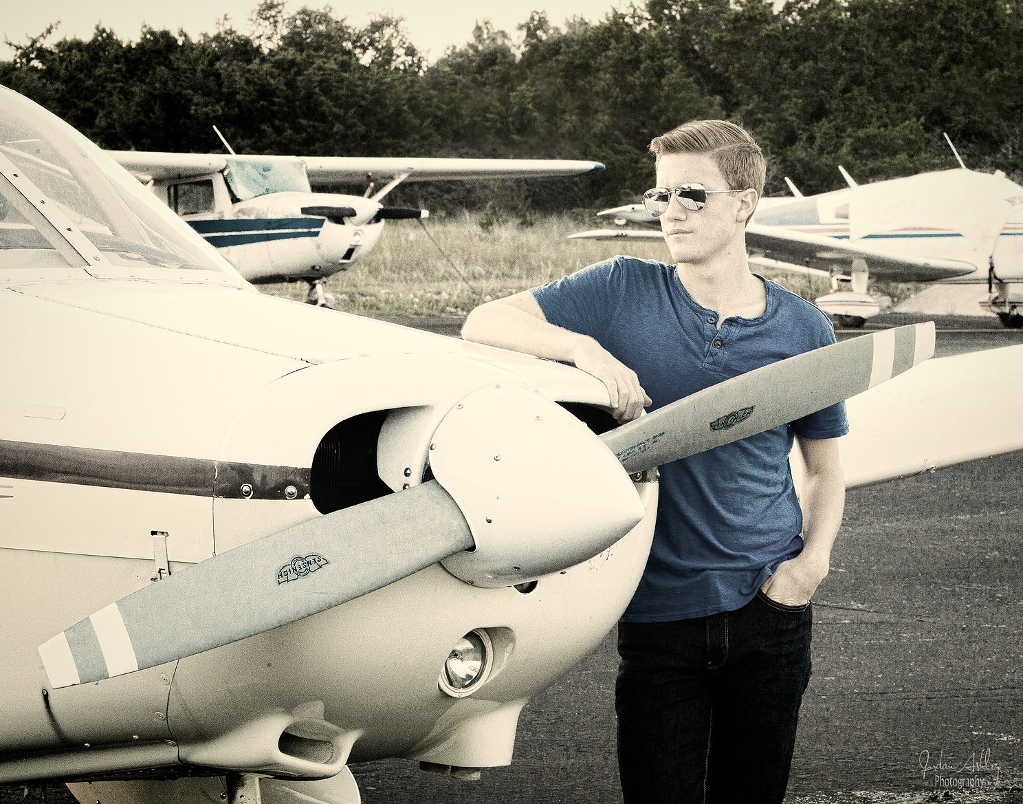 Senior photo with airplane