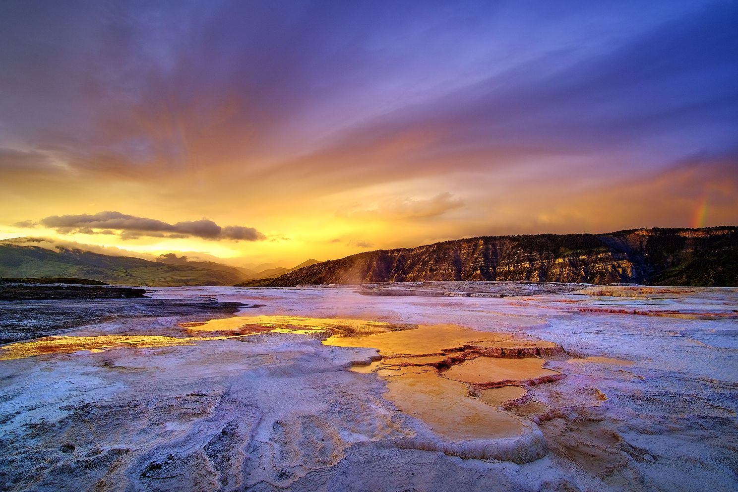 Sunset and a rainbow at Mammoth Hot Springs in Yellowstone National Park Wyoming
