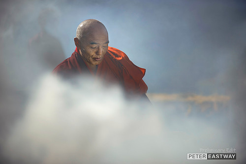 Lama blessing the raising of prayer flags, Oygen Chholing, Bhutan.
