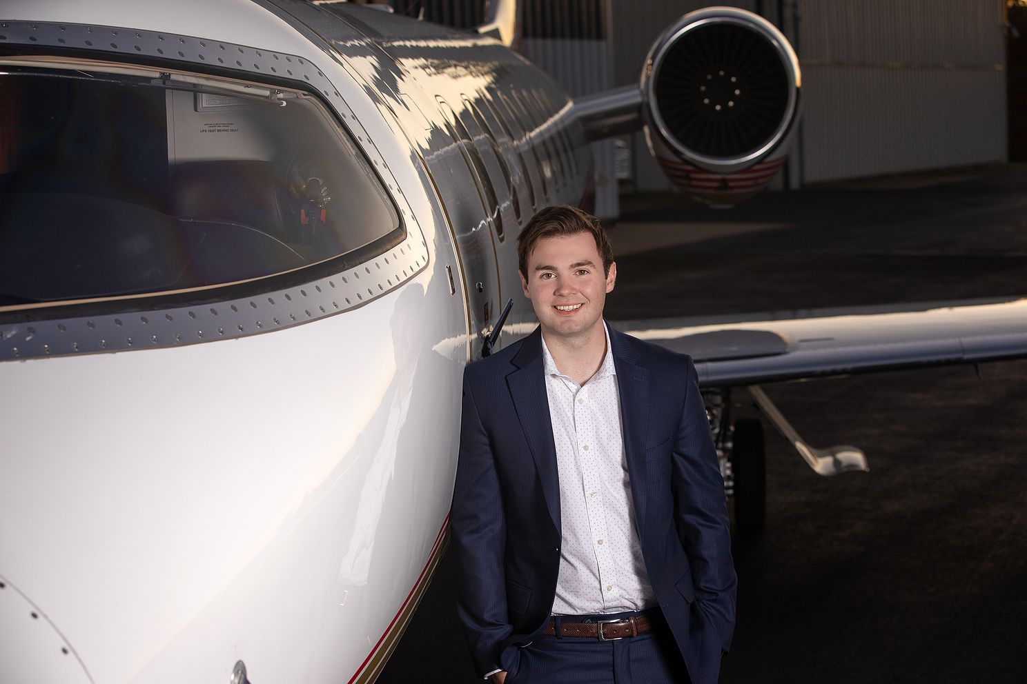 Senior portrait with airplane, future pilot 