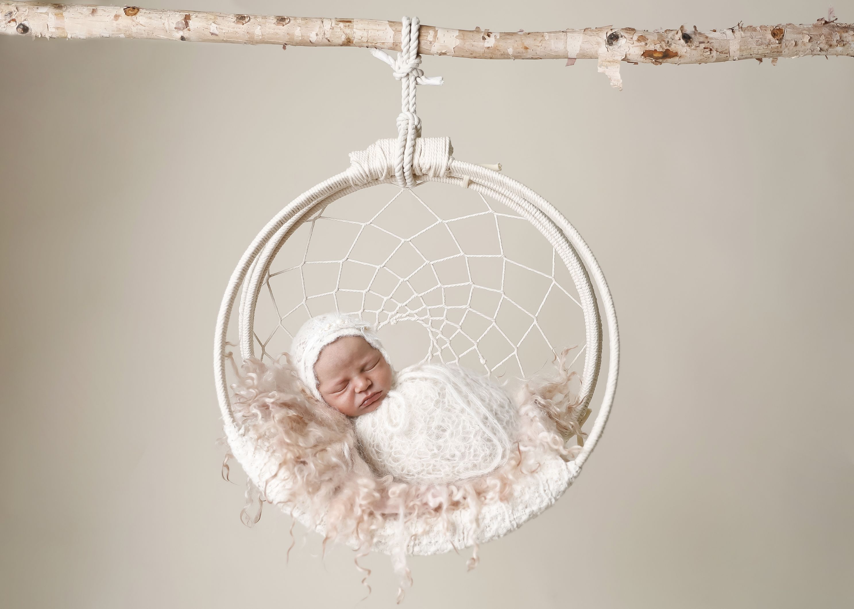 White dreamcatcher white wrap and matching bonnet, composite image. Accredited Photographer, girl
