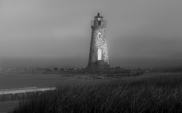 The gloomy mood is set by the lifting fog at the Cockspur Lighthouse