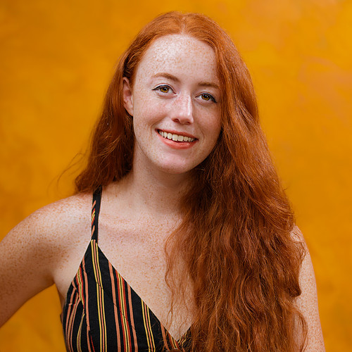 headshot portrait photography featuring happy red-haired girl sm
