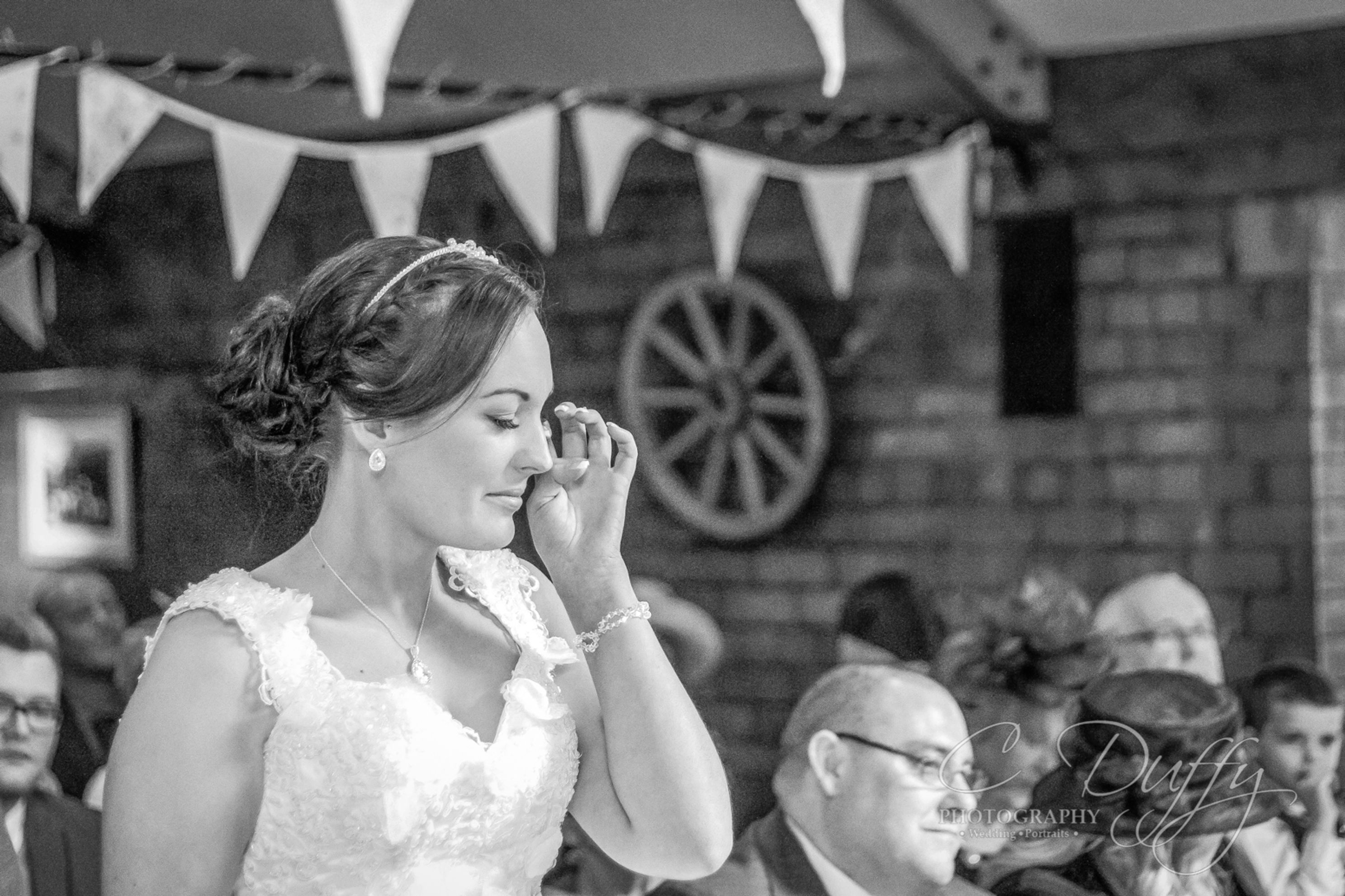 Natural moment of emotion captured at The Stables captured by Bury Wedding Photographer