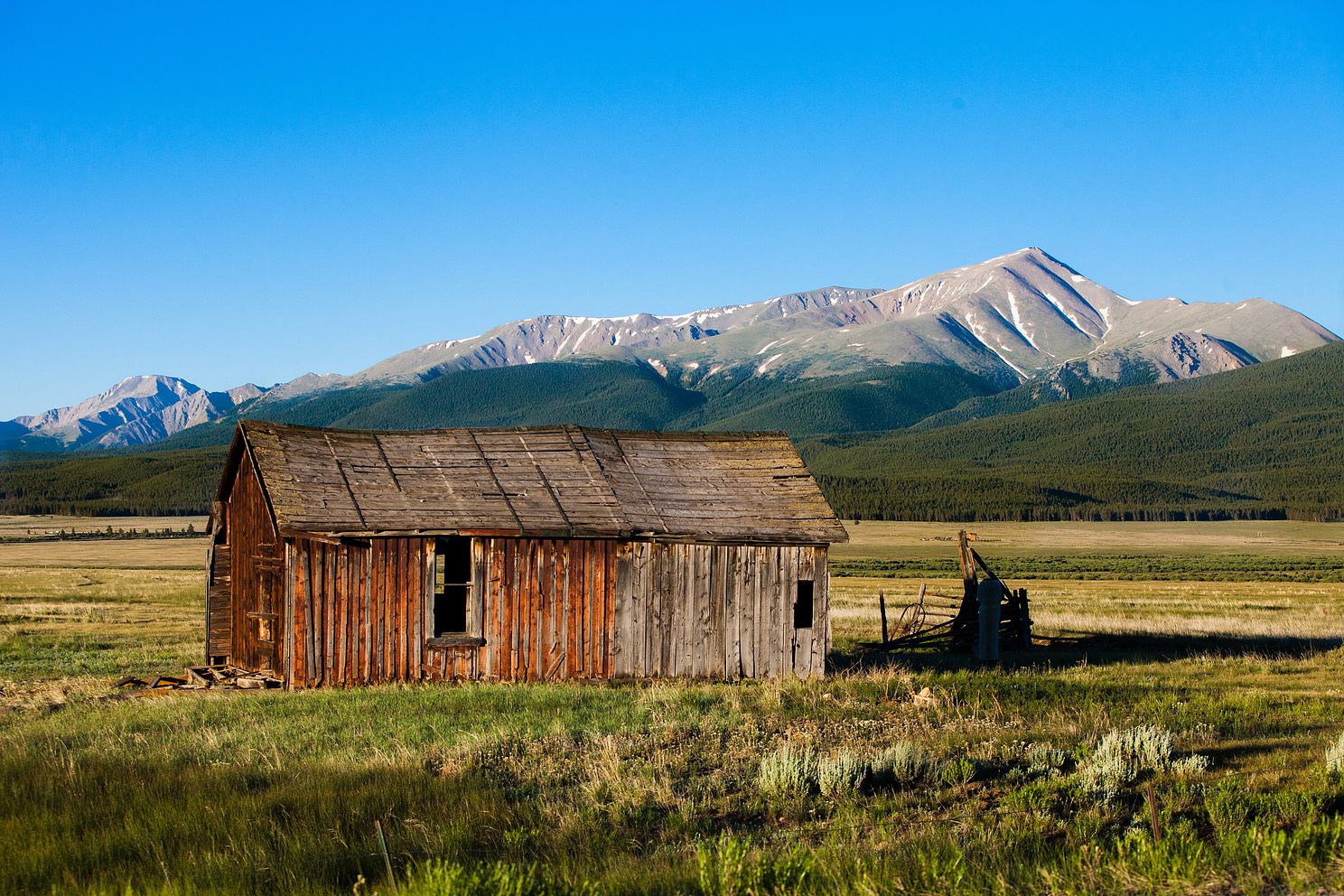 Old rustin barn on a cool cloudless morning with Mt. Elbert in the background