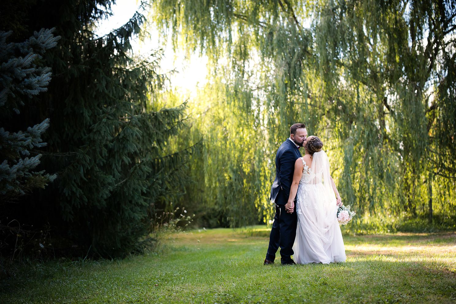 Couple walking side by side during golden hour in Chelsea Michigan.