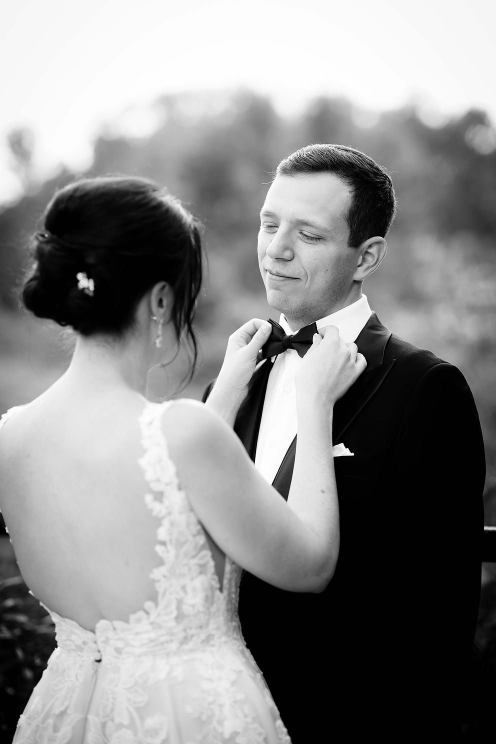Black and white photo of a bride and groom on their wedding day.