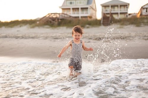 cute kid running ocean splash myrtle beach