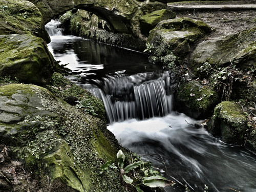Stream & waterfall, Beddington Park London. Long exposure with motion blur, moss on rocks adjacent.