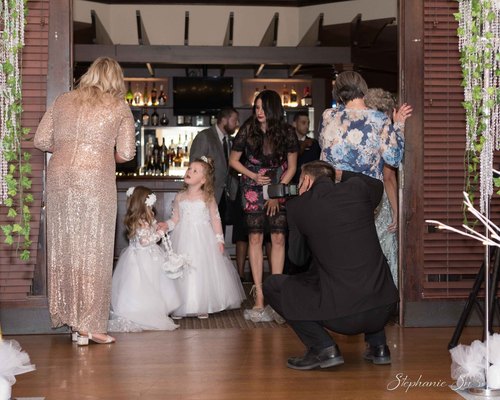 Mike photographing children before a wedding