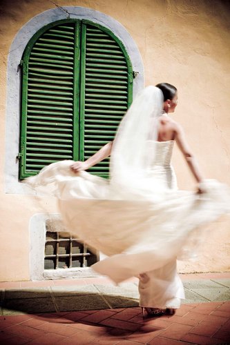 A bride spinning her dress photographed at her wedding in Swansea, South Wales