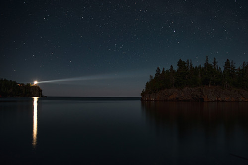 Split Rock Beacon  Split Rock Lighthouse lights up Lake Superior jpg