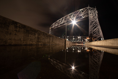 Duluth Reflections  The Aerial Lift Bridge reflects in a  puddlejpg