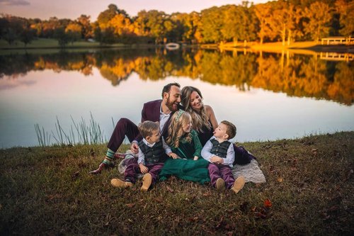 family picture near lake in Cary park