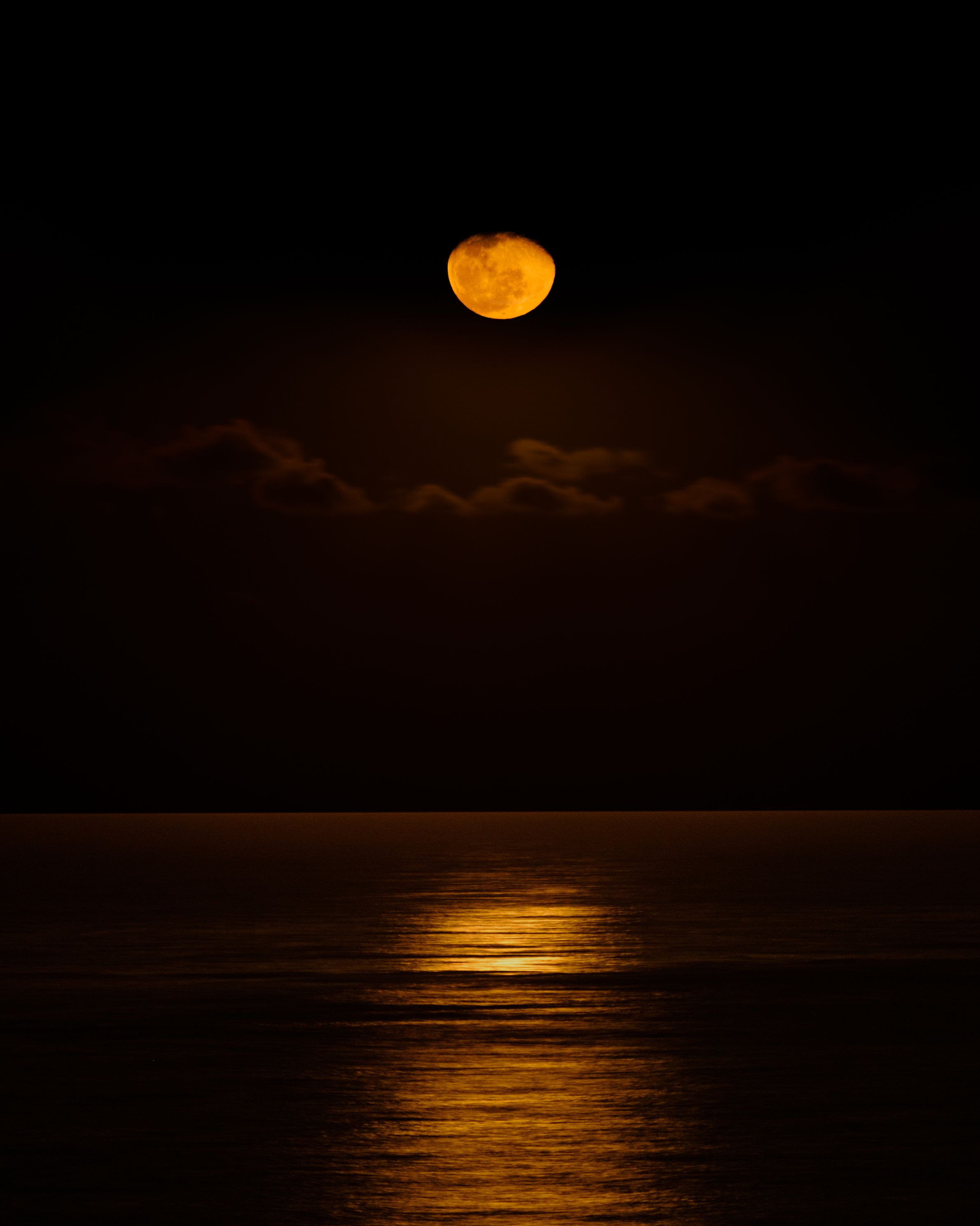 Moon at night over ocean